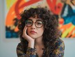 © Anowara - Creative portrait of a curly-haired woman wearing glasses with colorful artistic background.