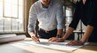 © macan - People reviewing architectural plans