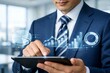 © Jumpei - タブレットでビジネスデータ分析を操作し成長戦略を立案する男性