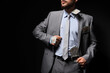 © Pixel-Shot - Man hiding money in suit pockets and collar