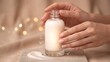 © ismail - Skincare serum bottle concept, hands holding glass bottle with cream swatch, drop, leaf, heart, checkmark icons, moisturiser, natural formula, hydration and beauty routine