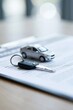 © Generative AI - Close-up of a car key and miniature vehicle on a document, symbolizing car purchase or rental agreement