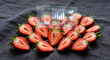 © Vitalii - Fresh halved strawberries with an AI analysis interface showing vitamin chemical structure and bar charts on a textured dark fabric background to visualize food technology research