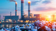 © Chineewan Somsap - Waste to energy facility with large pile of garbage in foreground, showcasing contrast between waste and energy production
