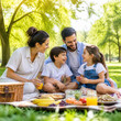 © Hannah - Happy family with two children enjoying summer picnic together in sunny green park