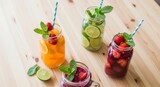 Refreshing fruit drinks in glass jars