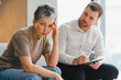 © Serhii - Woman feeling stressed during therapy session with psychologist