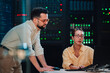 © Zamrznuti tonovi - It professionals analyzing data on laptop in server room, ensuring network security and optimized digital infrastructure