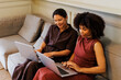 © BONNINSTUDIO/Stocksy - Two women working on laptops at office