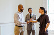 © BONNINSTUDIO/Stocksy - Business partners shaking hands sealing a successful agreement