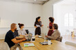 © BONNINSTUDIO/Stocksy - Business professionals working together during meeting at office