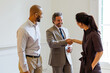 © BONNINSTUDIO/Stocksy - Business professionals shaking hands completing successful agreement