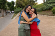 © Lupe Rodriguez/Stocksy - Portrait of happy friends celebrating their university graduation