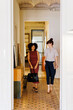 © BONNINSTUDIO/Stocksy - Professionals walking through office hallway