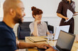 © BONNINSTUDIO/Stocksy - Professionals working together during a business meeting