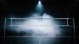 Volleyball net illuminated by a single spotlight on a dark background with atmospheric smoke volleyball spotlight