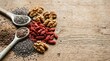 © Janet - Assorted healthy superfoods and nuts on a rustic wooden background