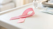 © Tacito - Pink ribbon symbol of breast cancer awareness on a medical tray