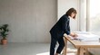 © Gail-Art - Focused female architect reviewing blueprints and digital tablet in modern office with natural light
