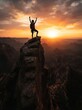 © Bear Studio - Silhouette of a hiker celebrating on a mountain peak at sunset.