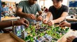 © kptncoro22 - Diverse students building sustainable scale city model together.