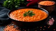 © suyu - Traditional red lentil soup in restaurant bowl with creamy orange puree texture, healthy vegetarian meal inspired by Middle Eastern cuisine, warm comfort food concept for Ramadan and everyday dining