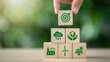© Joynob - Hand stacking wooden blocks with environmental icons for sustainable development