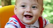 © Marco - Closeup of baby boy infant at playground park swing