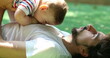 © Marco - Candid authentic father and baby boy relationship lifting son