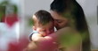 © Marco - Candid mother holding tenderly infant baby son