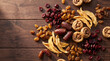 © Alena - Dried fruits including figs, dates, raisins, apricots, and cranberries arranged on a wooden surface, showcasing various textures and colors in a natural setting