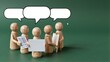 © joeycheung - Wooden figures gather, speech bubbles above them suggest dialogue or brainstorming.