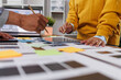 © David - Ux designers engaging in a collaborative planning session. Reviewing app interface designs. Implementing mobile user experience principles. Tablet. And sticky notes