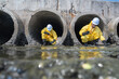 © Surachai - Environmental professionals performing water quality assessments in a city drainage system