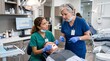 © M Fahad - Senior Dentist Supervising Dental Student During Patient Examination in Modern Dental Clinic