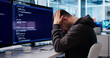 © Andrey Popov - Young Software Engineer Looks Tired And Stressed While Coding