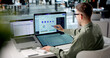 © Andrey Popov - Customer Service Manager Reviews Complaint Dashboards Using Laptop