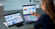 © Andrey Popov - Woman Reviews Financial Data On Dual Touchscreen Laptops
