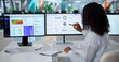 © Andrey Popov - Woman Uses Computer Software To Review Risk Dashboard