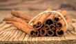 © Chandlerlikes - cinnamon sticks on wooden surface