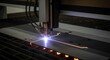 © Lim - Precision plasma cutting machine precisely carves intricate patterns into a metal sheet with intense sparks and glowing light