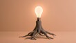 © Naufal - Tree roots sprout a glowing lightbulb, symbolizing new ideas and innovation