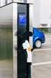 © Olga Prahoda/Stocksy - Charging station for electric vehicles in the parking lot.