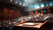 © Carmen - Microphone with paper pad and pen at podium, audience in theater in background