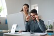 © Prostock-studio - Focused Man And Woman Engaged In Productive Discussion While Working Together At Office Desk, Smiling And Checking Information On Computer, Setting Values For Successful Project. Business Concept.