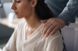 © Prostock-studio - Concerned Hispanic Female Employee Receives Support From Male Colleague In Office Setting, Their Focus On Work And Collaboration. Business Concept In Professional Environment.