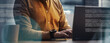 © Prostock-studio - Focused Unrecognizable Person Typing On Laptop While Sitting At Desk In Modern Office, Engaged In Work. Ideal For Illustrating Business And Professional Work Environment.