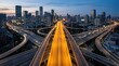 © soem - A long elevated highway system stretches across a cityscape at twilight. Multiple roadways converge at a complex interchange, creating a network of illuminated lanes.