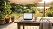 © MT - Remote workplace laptop on wooden desk outdoors in sunny garden for freelancing and telecommuting
