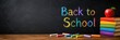 © Mariia - Colorful Back to School message written on a classroom chalkboard with books, apple and chalk. Educational horizontal banner with copy space for school promotions, learning and academic events